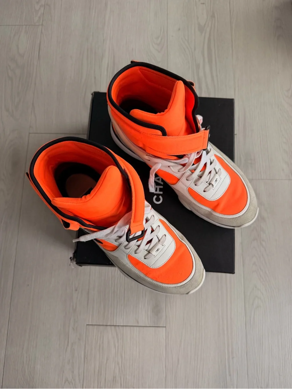 CHANEL Orange and Black High-Top Sneaker